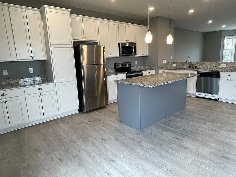 Step into modern living at LS Capital Group. This stylish kitchen boasts sleek cabinetry, state-of-the-art appliances, and ample counter space, perfect for culinary adventures. Don't miss out on your dream homeAaaschedule a tour today!