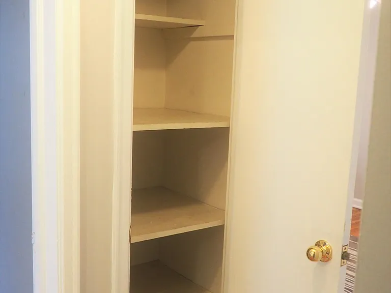 Floor to ceiling hallway linen/towel closet