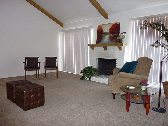 Vaulted Living Room features fireplace with gas logs!
