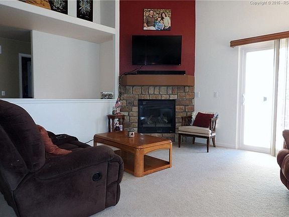 Corner Fireplace and Walk Out to Patio