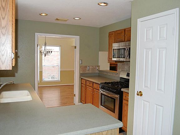 Another view of kitchen looking out to formal dining room