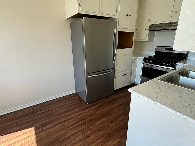 kitchen with new stainless refrigerator