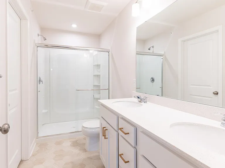 Owner's Bathroom (closet located to through door across from vanity)