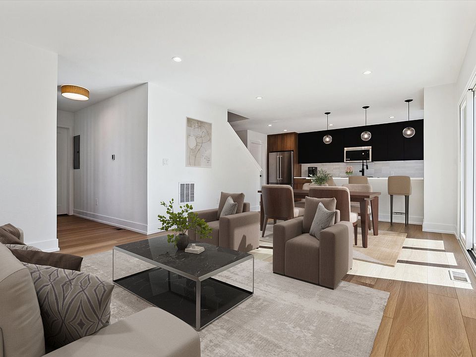 Spacious Living Room with Kitchen Island & Bar Seating, Great for Entertaining - Virtually Staged