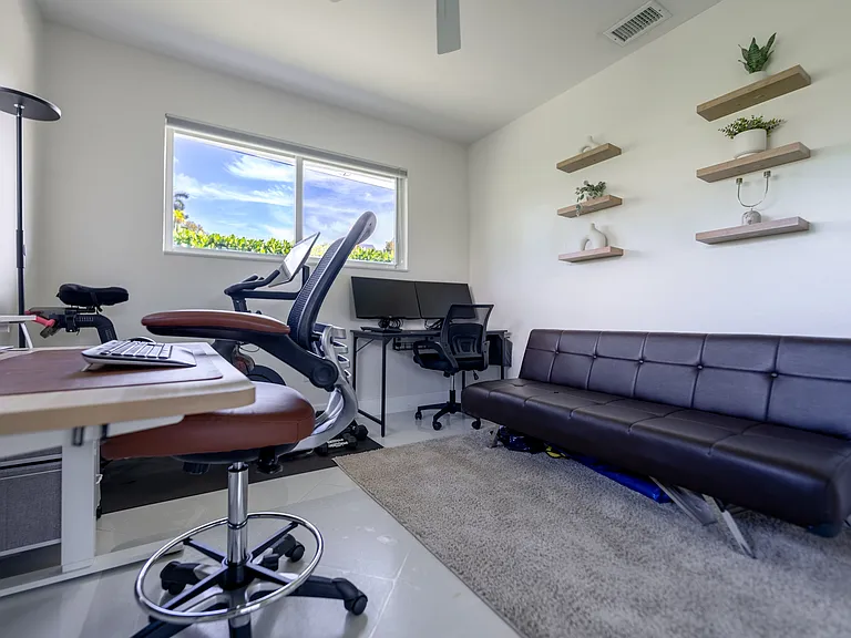 Bedroom 3 - Option to setup as office with desks, monitors, peloton, dumbells and futon