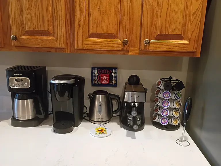 The coffee and tea bar provides several options for making your favorite drinks. K-pods and tea bags are provided as a starter.