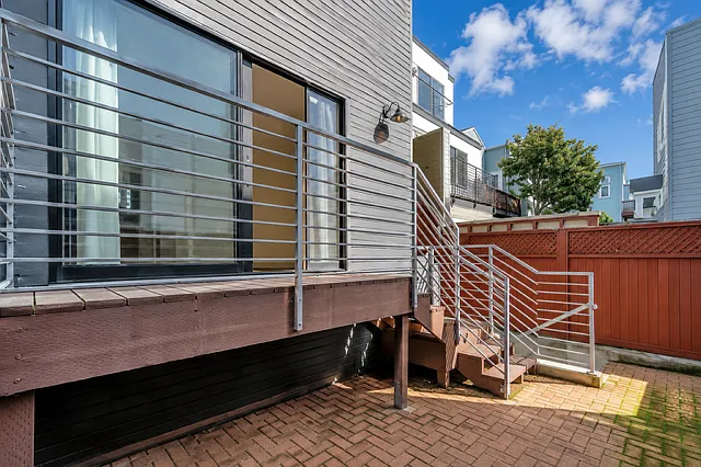 private backyard, master bedroom deck doors on left