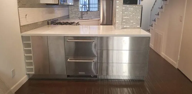 looking into kitchen.. etra refrigerator and storage