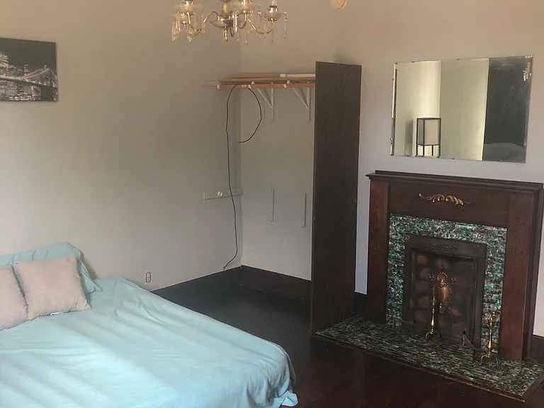 Main level bedroom. room is 15 ft x 15 ft. Fireplace is decorative only