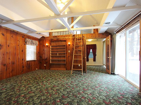 Vaulted Ceiling in Living Room, Ceiling Fan with Ladder Leading to Loft