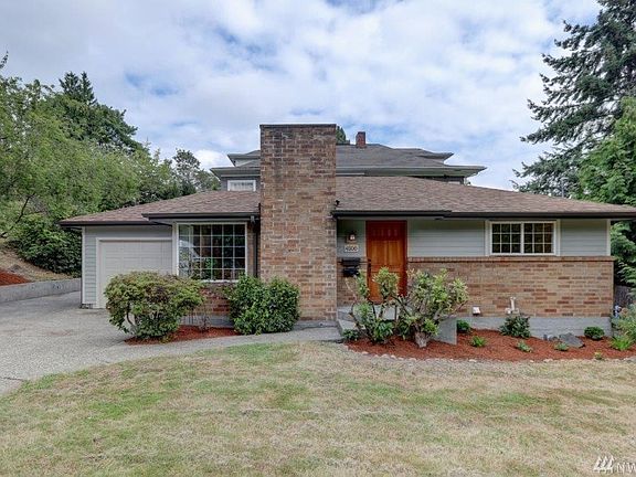 Front of house. One car attached garage and off-street parking. Large level lawn. 