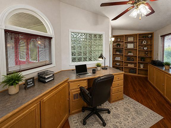 Office with tons of bookshelf storage and natural light. Run your business from home! 

Images are virtually staged using AI to showcase the home's potential. Actual layout and finishes are accurate; furnishings are not included.