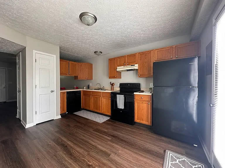 Kitchen / Dining room - Updated plank flooring and freshly painted.