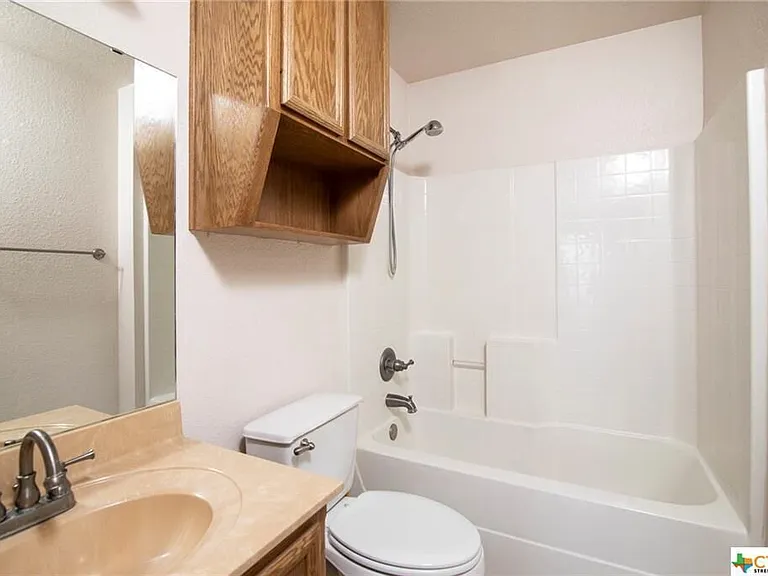 Hall bathroom serving secondary bedrooms.