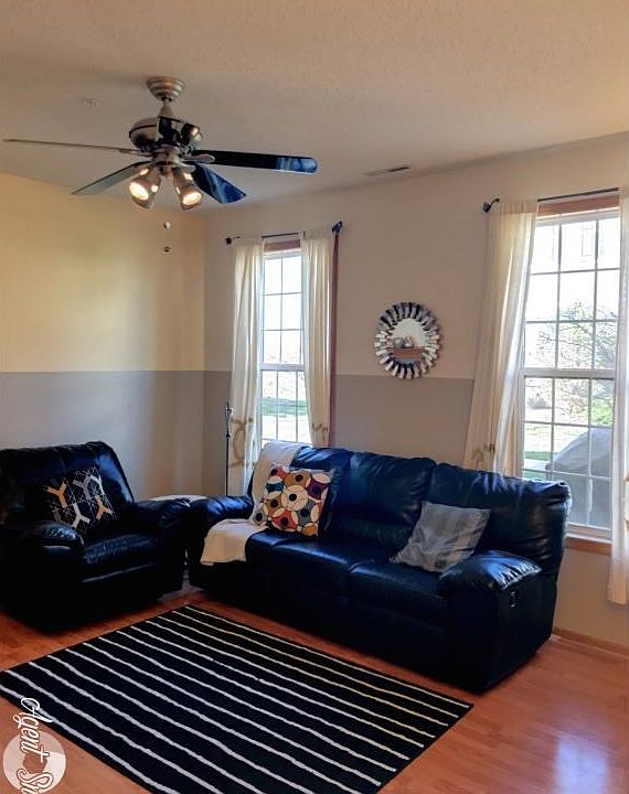 main level living area with big windows that lets the natural light in!