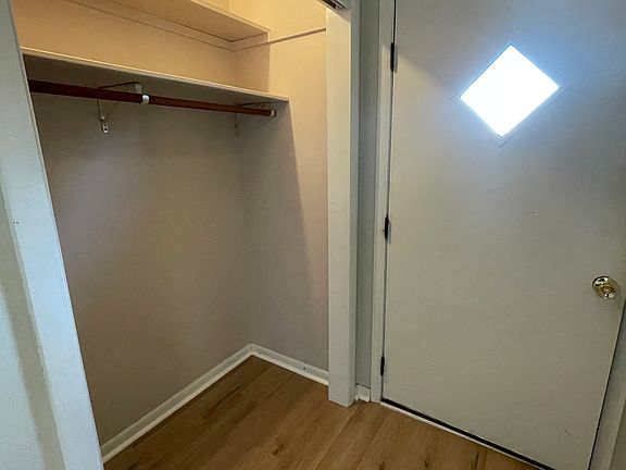 Front entry with open closet.