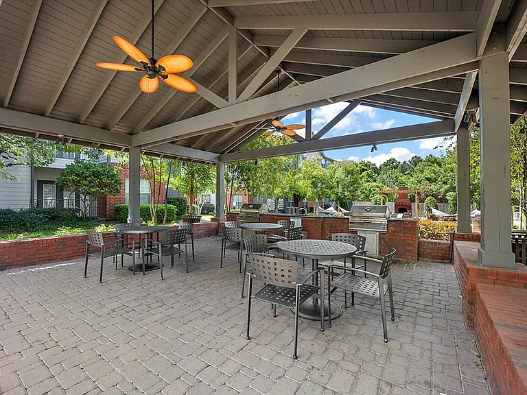 Host Gatherings at the Outdoor Grilling and Dining Area at Eagle Flatts Apartments in Hattiesburg