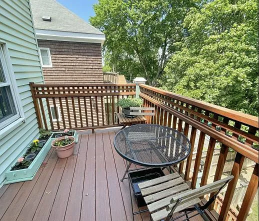 Rear porch overlooking community path, there's another porch in the front.