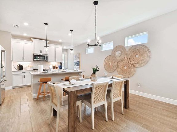 Sandpiper new construction luxury paired villa home plan cafe dining area in 55 in Sun City Center,