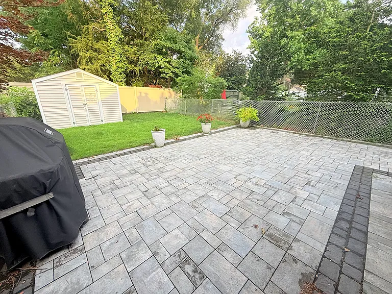 Fenced in Backyard with Paver Patio, Grill, and Shed