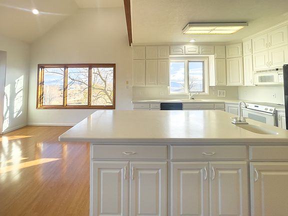 The large central island is the heart of the kitchen, where guests can gather and food can be served with ease.