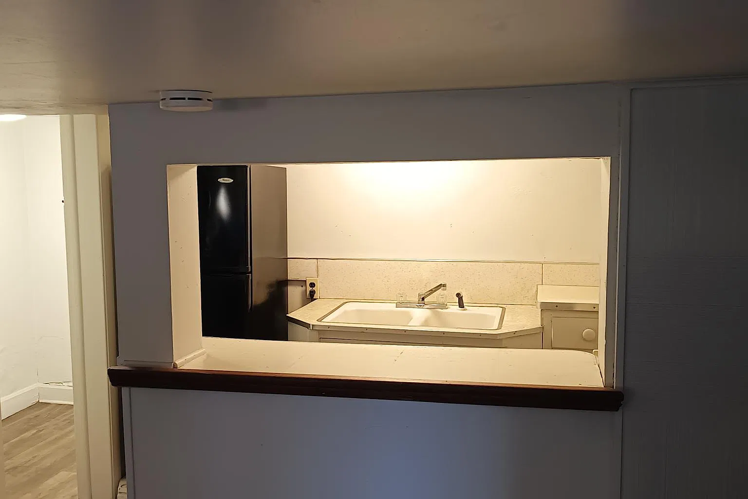 View of Kitchen and Bathroom from Breakfast bar.