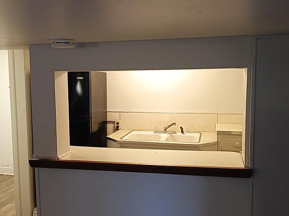 View of Kitchen and Bathroom from Breakfast bar.