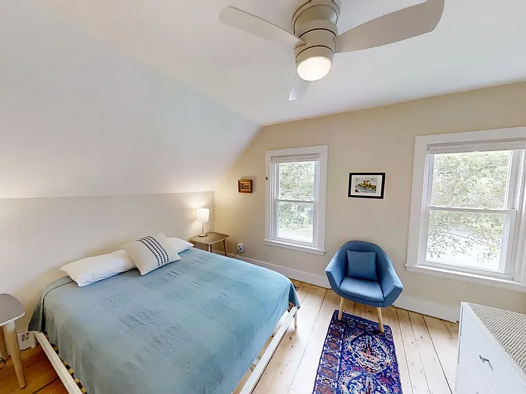 Second level primary bedroom with queen size bed