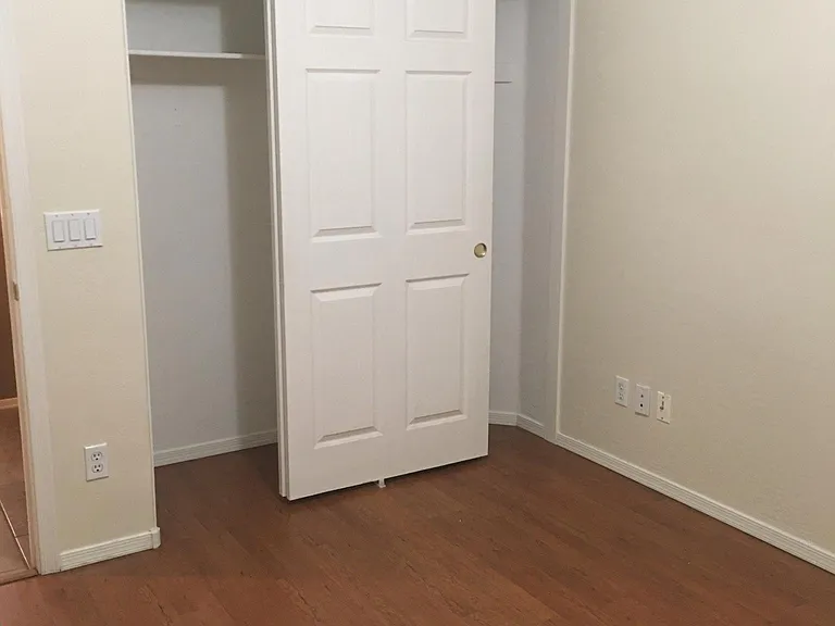 Guest bedroom #1 with new paint and laminate flooring.