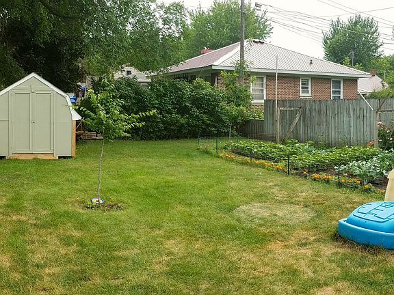 back/side yard w/storage shed & garden