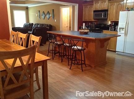 Kitchen, dining, living
						:
						Picture taken from rear entry, laundry room right of kitchen, master left