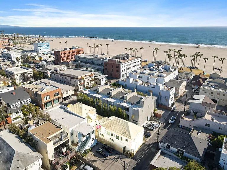 We are the highlighted building with tiny pink umbrella in the middle of our 2 buildings
