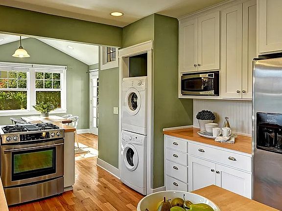 kitchen view from living room, brand new fridge in 2022