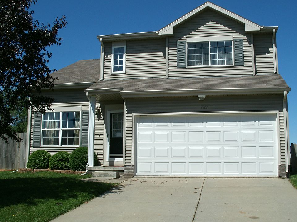 two story home with full, partially finished walkout basement