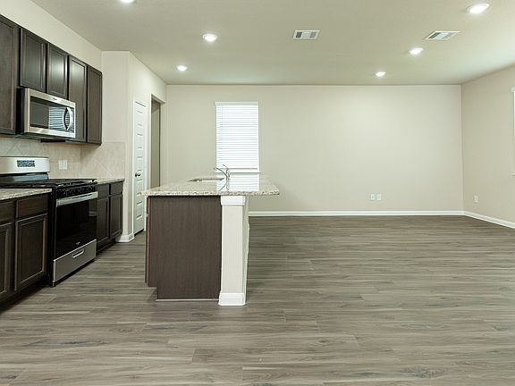 Family Room to Dining Area and Kitchen