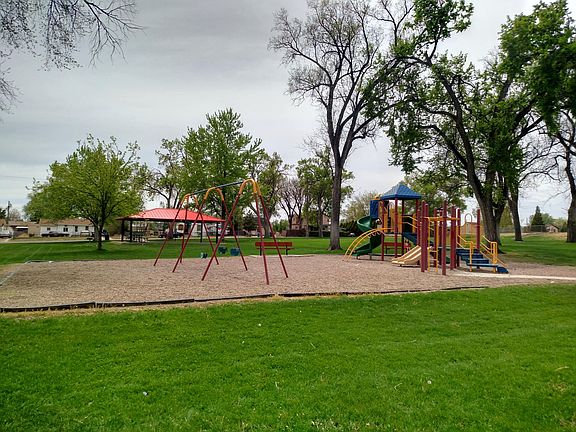 House is a few steps away from this park and playground.