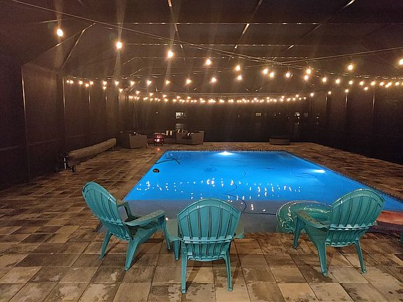 Nighttime by the pool with fire