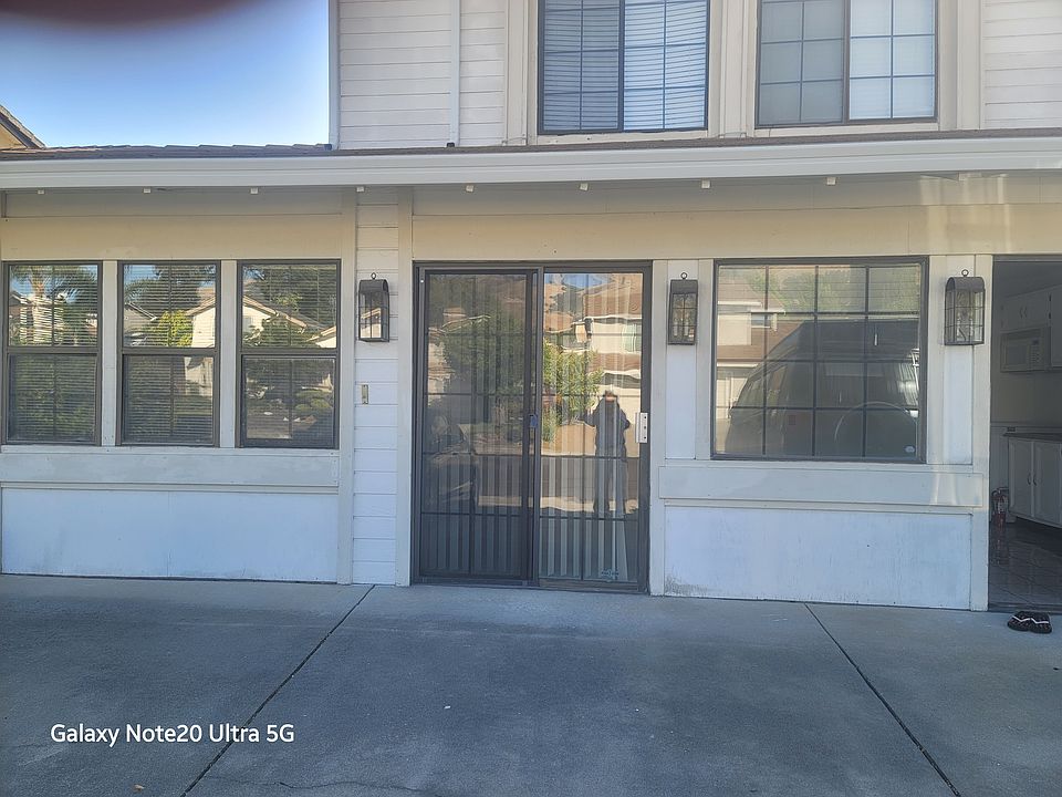 Front view of 2 bedroom, 1 bath unit (attached to main home) with one parking spot available in front of unit.