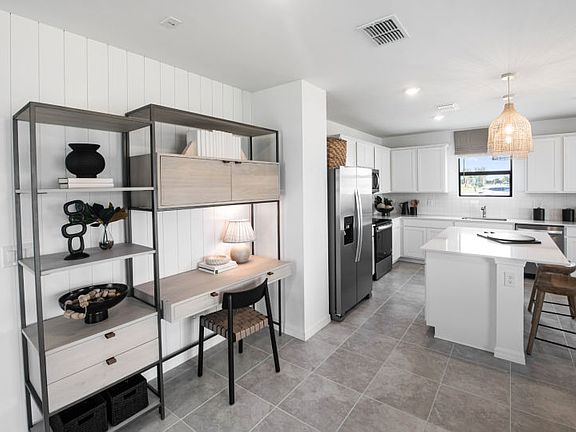 Gathering room in this 2-story home design