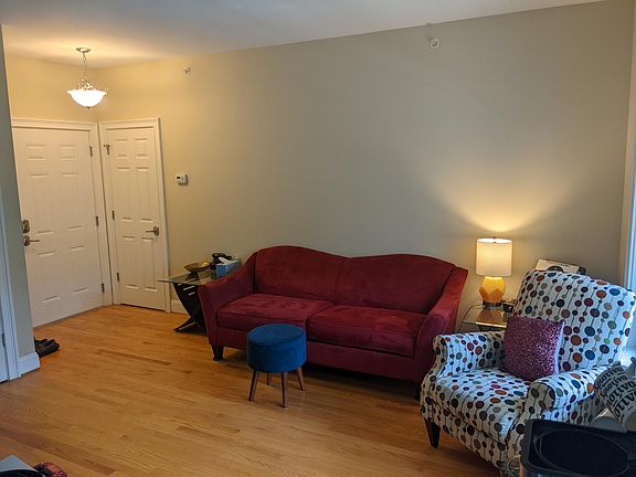 Living room with hardwood floors. Furniture not included.