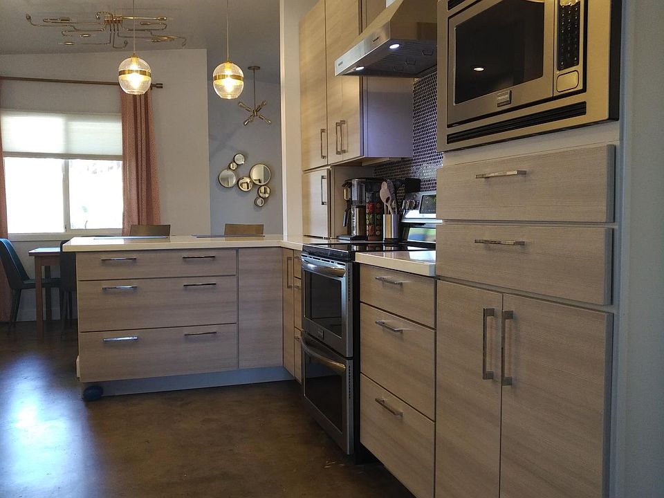 Kitchen view. Note the pantry storage cabinet that houses the microwave