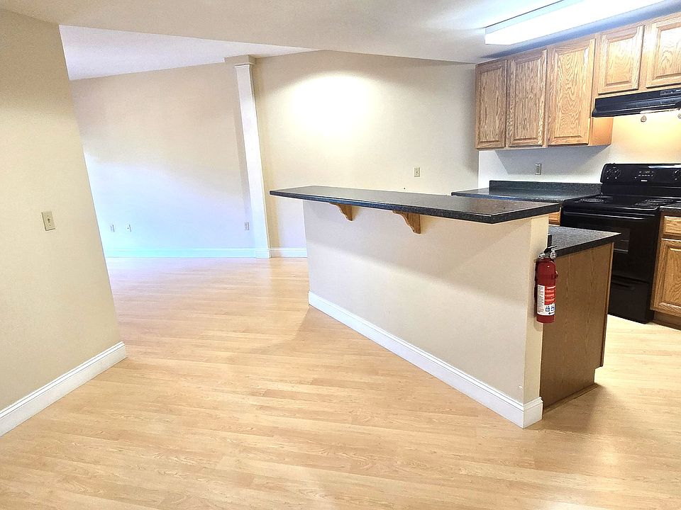 open concept kitchen with breakfast bar and dining area