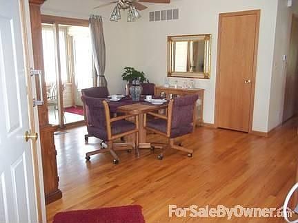 dining area with view of sun porch
						:
						sky light in celing near dining room table