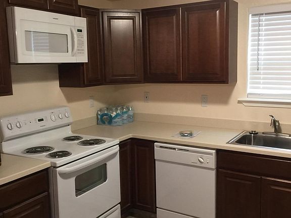 New modern appliances with lots of kitchen cabinets