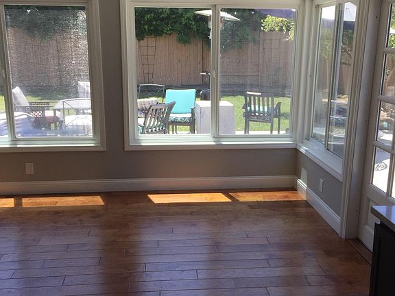 View from kitchen to dining area and backyard