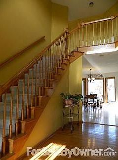 Family room with Wood Burning Fireplace
						:
						At back of house with many windows and built-ins. Step down (9 ft ceilings)
