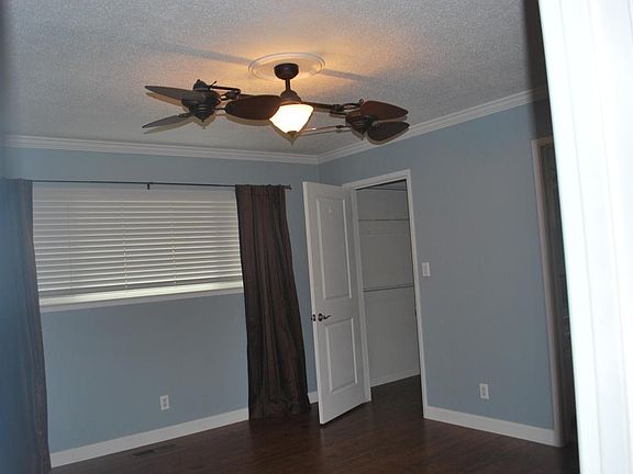 master bedroom with double ceiling fan