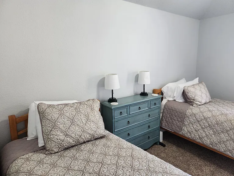 2 Twin Beds, dresser, large TV for gaming or movies, closet