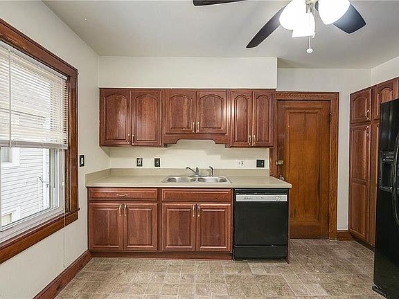 Kitchen with garbage disposal, dishwasher, plenty of cabinets, and refrigerator