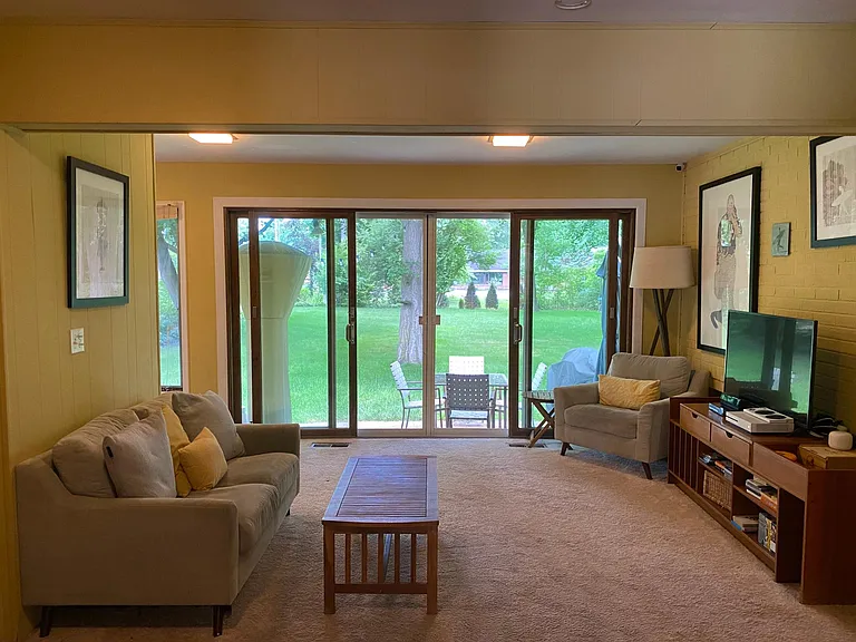 Family room (furnished view, older paint colors)